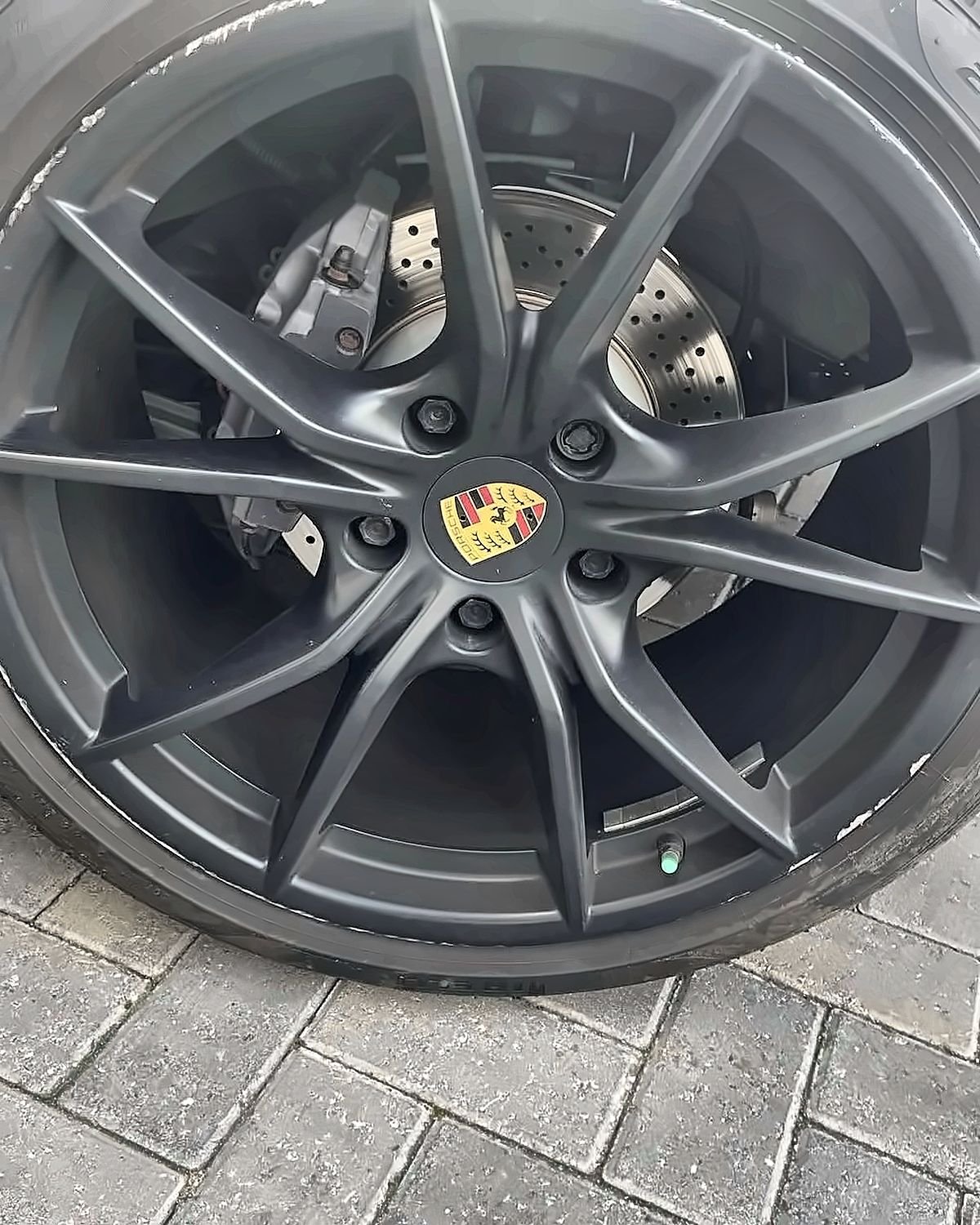 Porsche alloy wheel by Prestige Alloy Repair - Satin black, close up