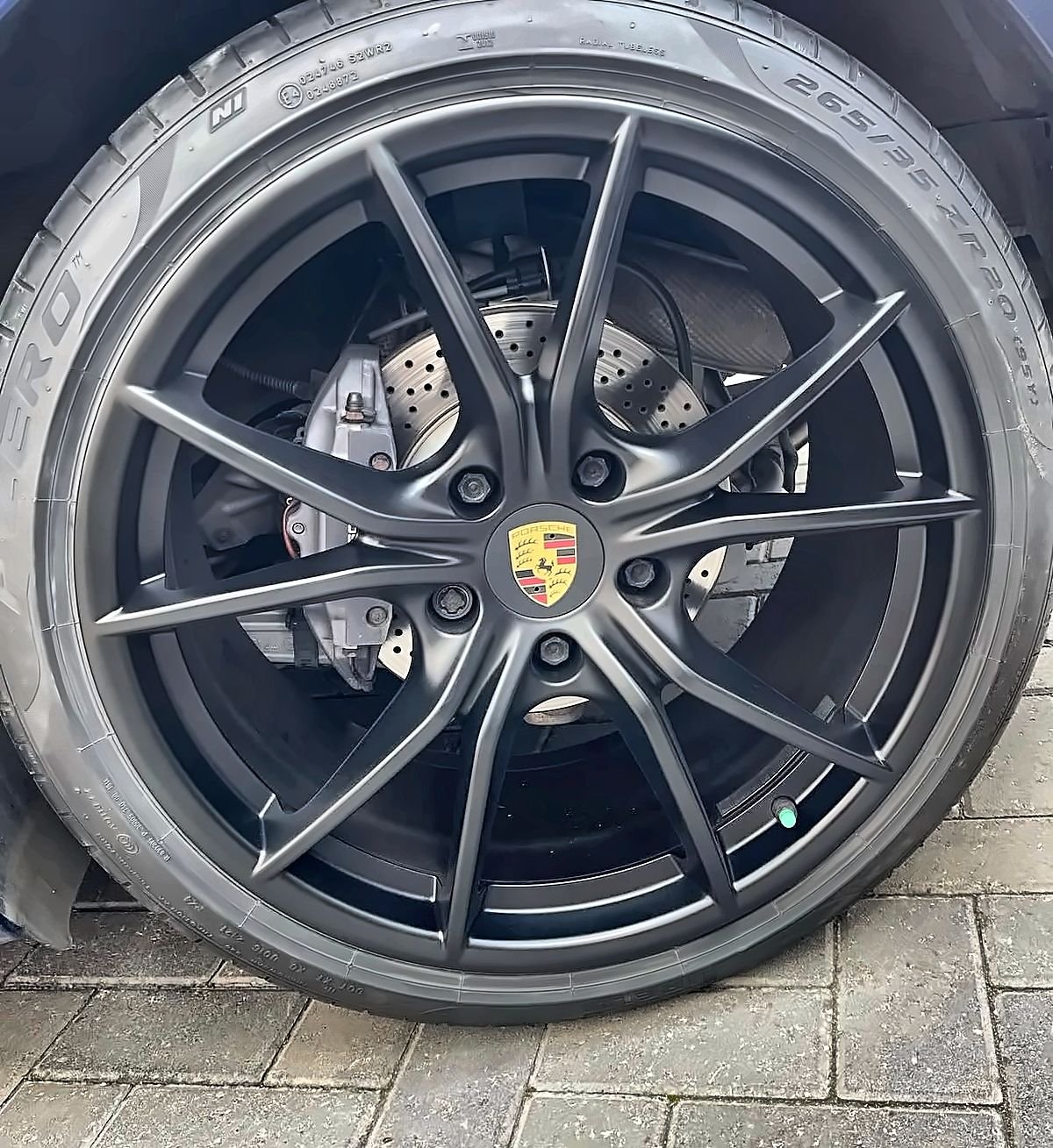 Porsche alloy wheel refinished in satin black by Prestige Alloy Repair