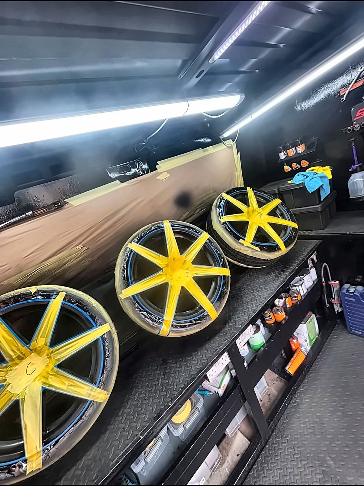 Alloy wheels masked and prepared for a two-tone colour change