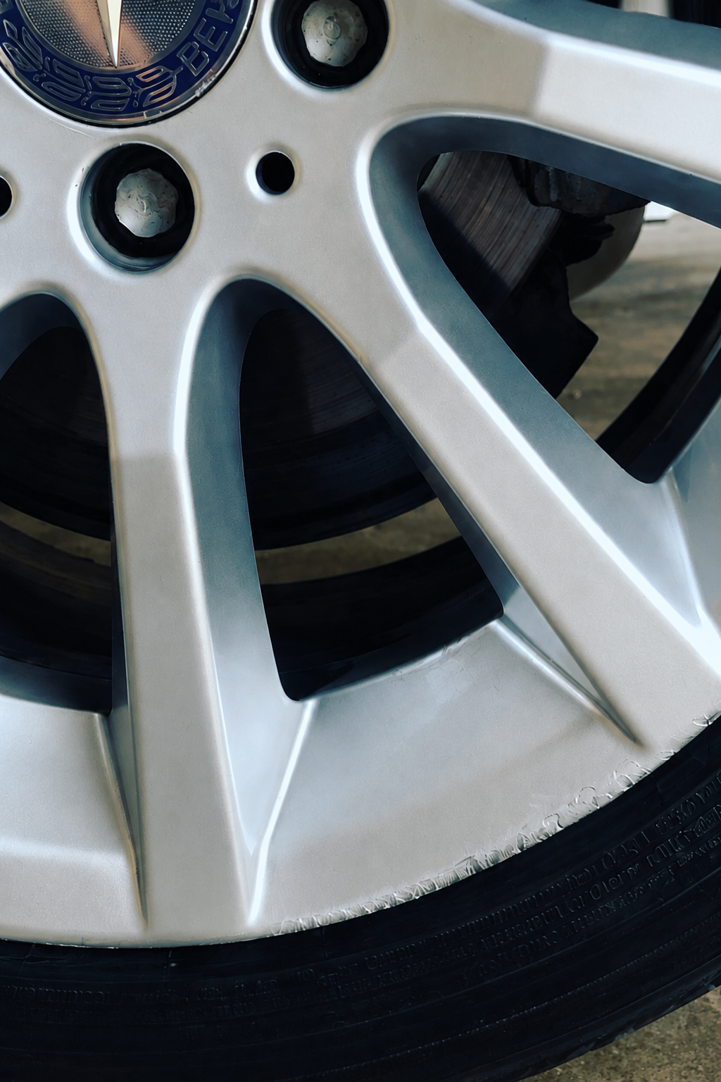 BMW alloy wheel before - Smart repair - Kerb damage repaired